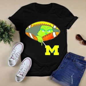Grinch Peeking From Football Over Michigan Wolverines T-Shirt