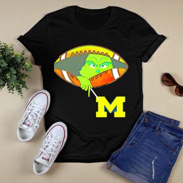 Grinch Peeking from Football Over Michigan Wolverines T Shirt Black 1